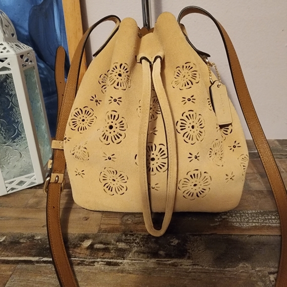 Coach Handbags - Coach Suede Bucket Bag Floral Cutouts EUC Beige/Cream